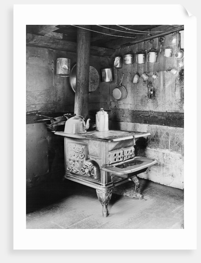 Old Stove Inside Log Cabin Kitchen by Anonymous