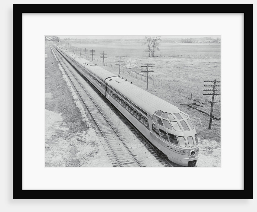 Streamlined Train Cars on Daytime Schedule by Anonymous