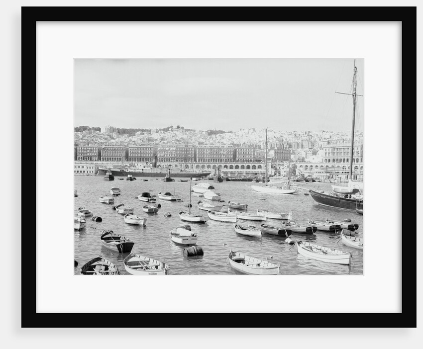 Boats in Harbor Outside City by Anonymous