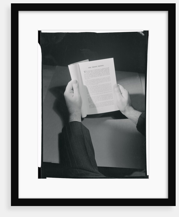 Hands Holding Open Booklet by Anonymous
