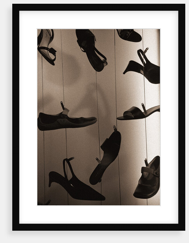 Ladies Shoes Hanging on Wire by Anonymous
