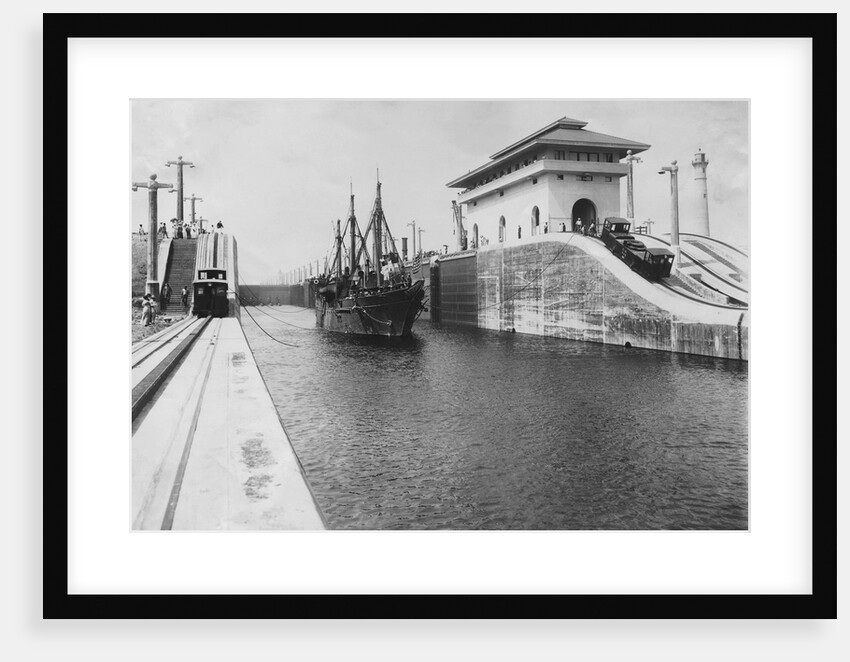 Pulling Tender Through Panama Canal by Anonymous