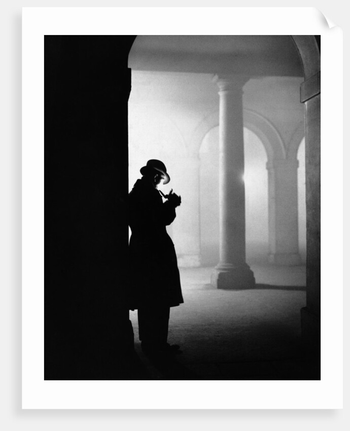 Silhouette of Man Lighting Pipe by Anonymous