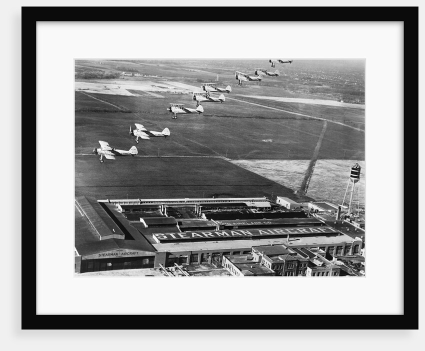Aeroplanes Flying Above Stearman Aircraft Factory, 1941 by Anonymous
