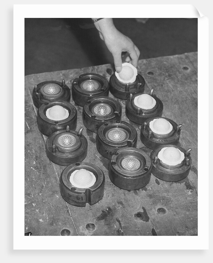 Golf Balls in Molds by Anonymous
