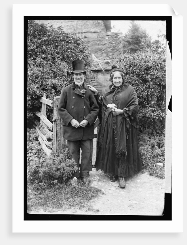 Elderly Couple Standing by Fence by Anonymous