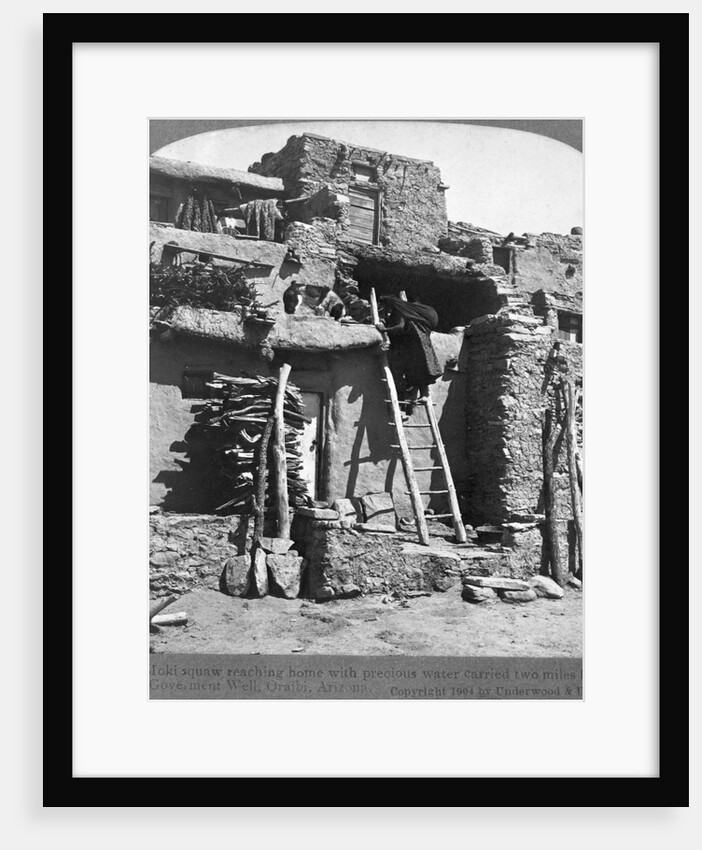 A Moki Squaw Carries Water up a Ladder to her Pueblo by Anonymous