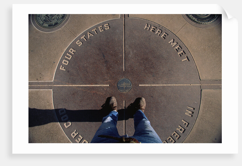 Tourist Standing on Four Corners Monument by Anonymous