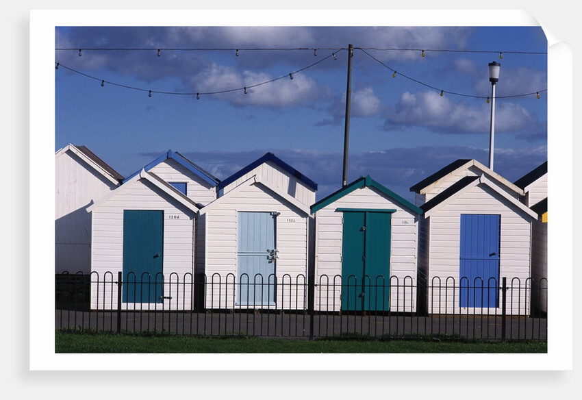 Beach Huts on Devon Town's Waterfront by Anonymous