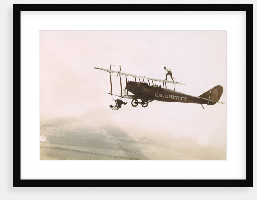 Photograph of a Wingwalkers on a Biplane by Anonymous