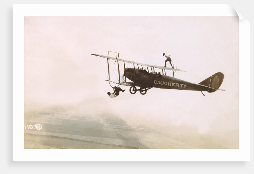 Photograph of a Wingwalkers on a Biplane by Anonymous