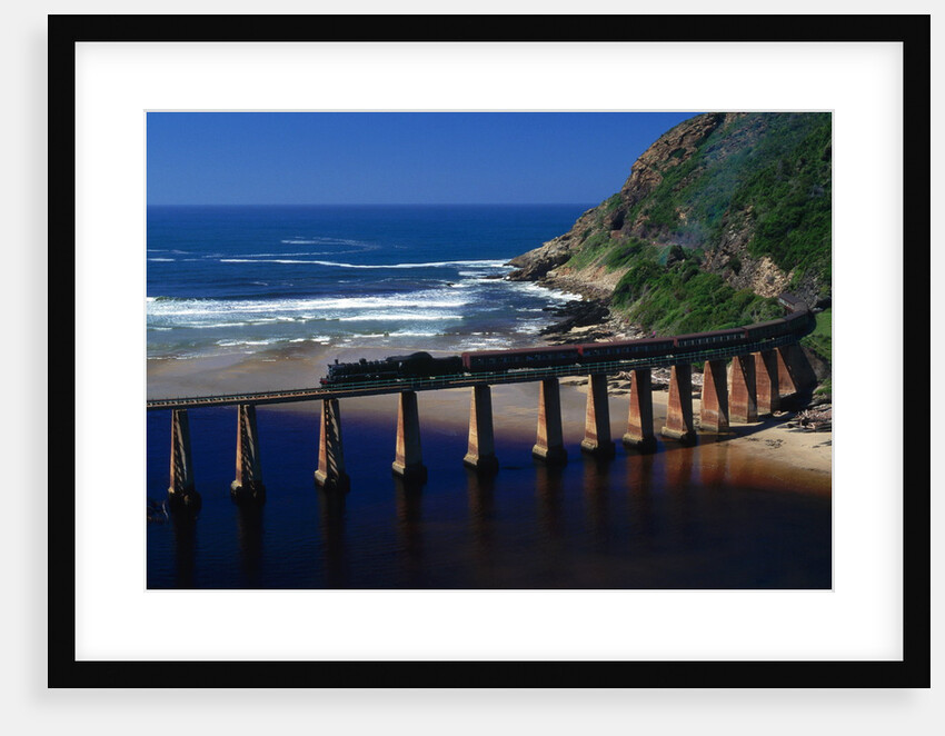 Train Crossing River on Trestle Bridge by Anonymous