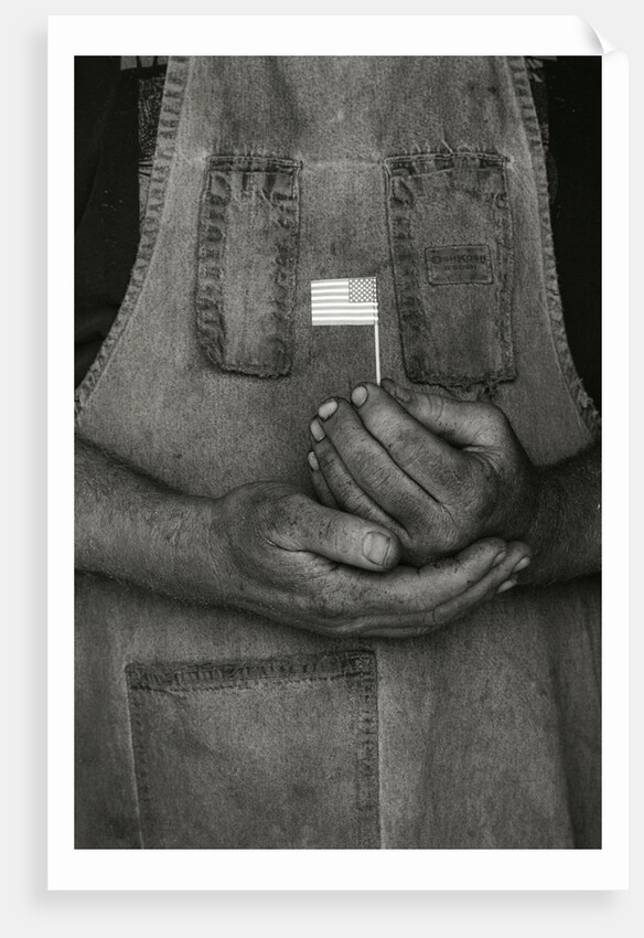Man Holding Small American Flag by Anonymous