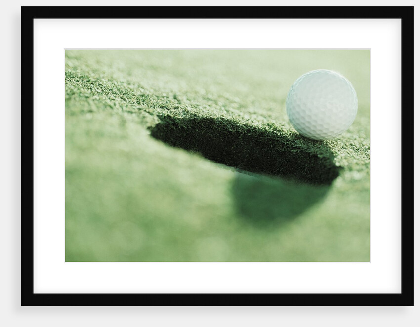 Golf Ball on the Edge of the Hole by Anonymous