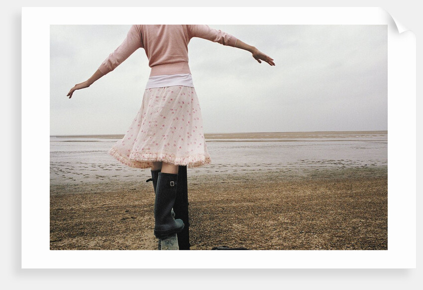 Woman Balancing on a Breakwater by Anonymous