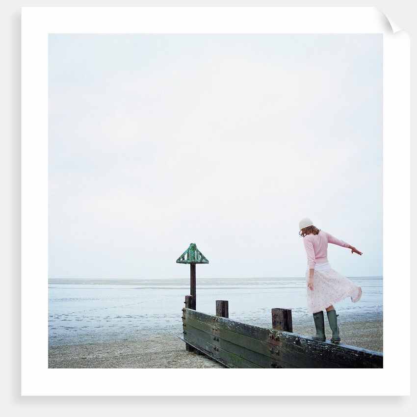 Woman Balancing on a Breakwater by Anonymous