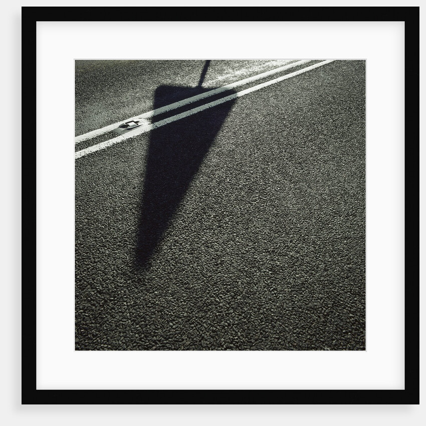 Shadow of Sign on Road by Anonymous