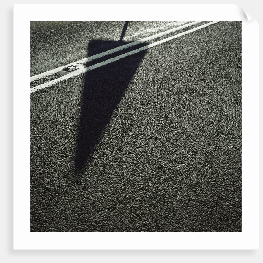 Shadow of Sign on Road by Anonymous