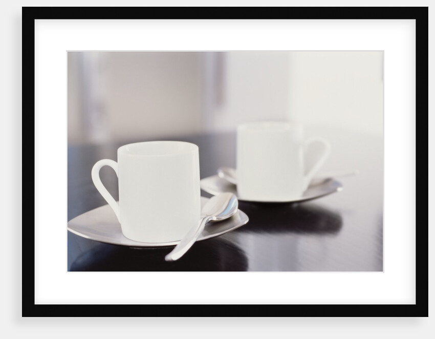 Two coffee cups on a table by Anonymous