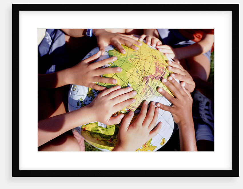 Children's Hands on Inflatable Globe by Anonymous