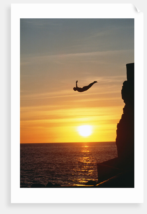 Cliff Diver Above Setting Sun by Anonymous