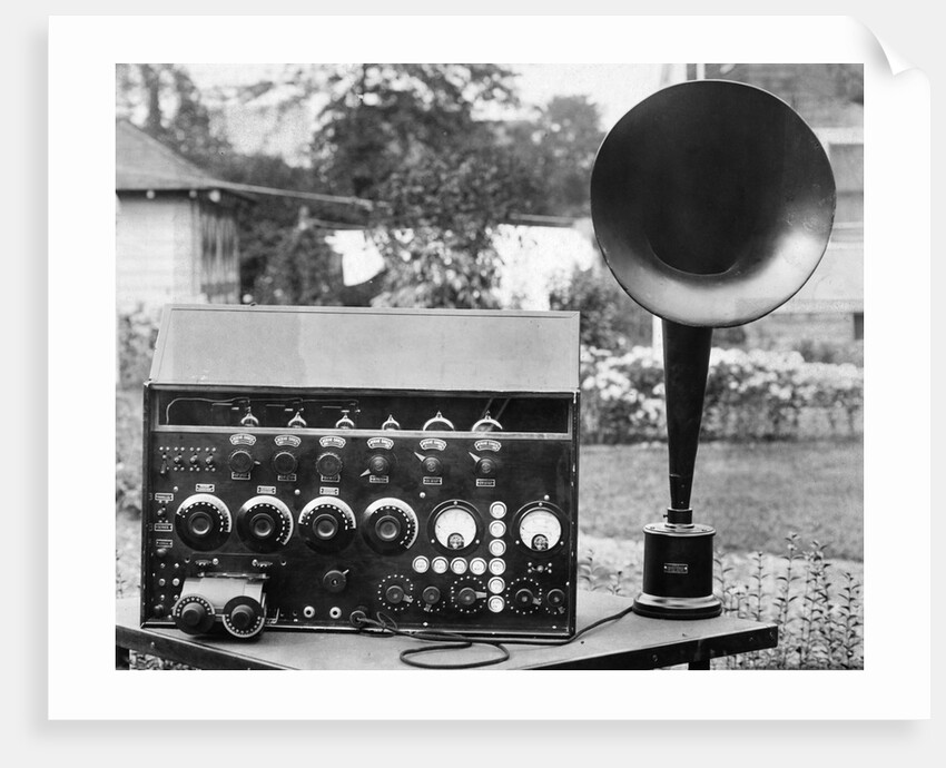 Display of an Early Radio on Residential Lawn by Anonymous