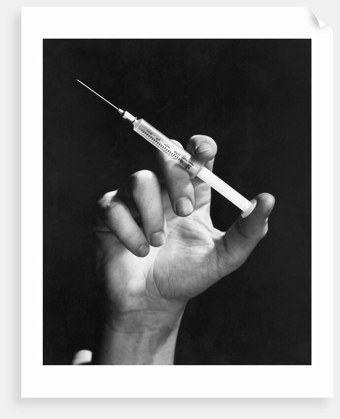 Hand Holding Syringe by Anonymous