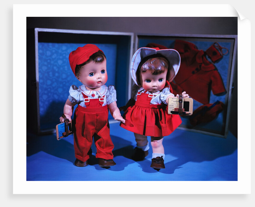 Boy and Girl Dolls Wearing Matching School Outfits by Anonymous