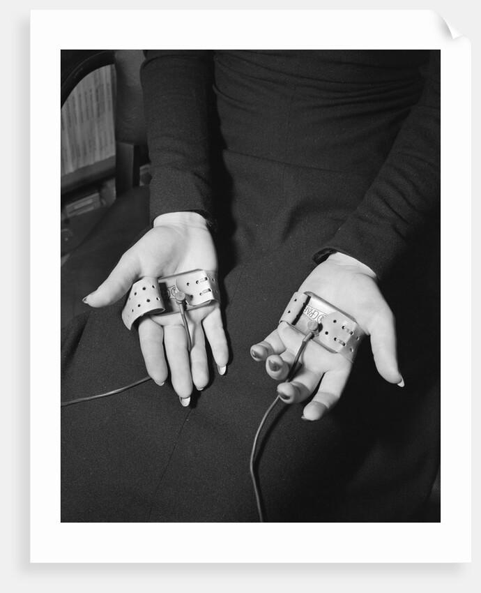 Pair of Hands Wearing Lie Detector Device by Anonymous