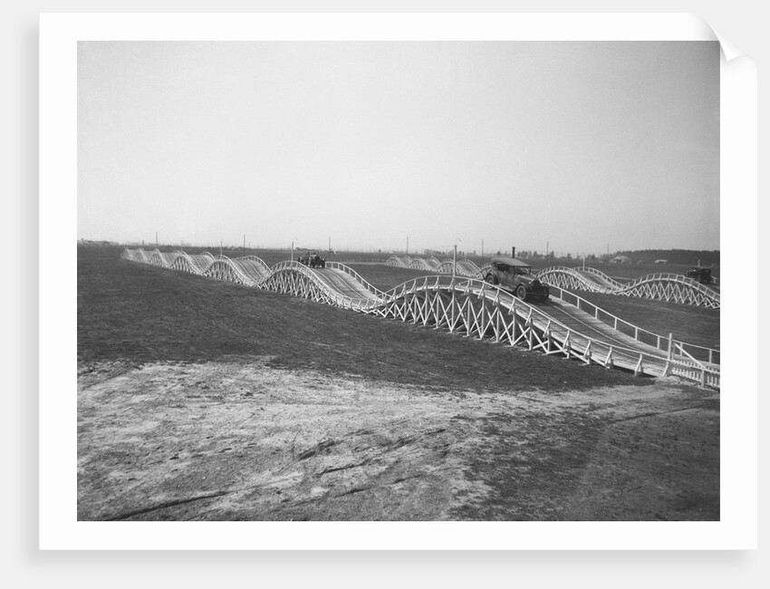 Cars Driving Along an "Auto Thriller" Highway by Anonymous