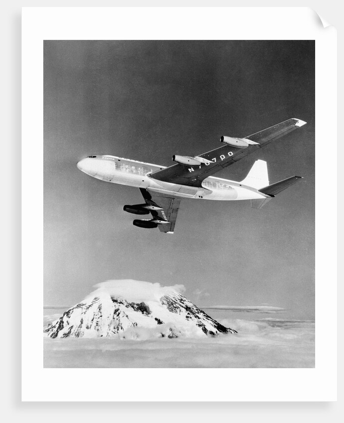 Large Aircraft Flying over Mountainous Region by Anonymous