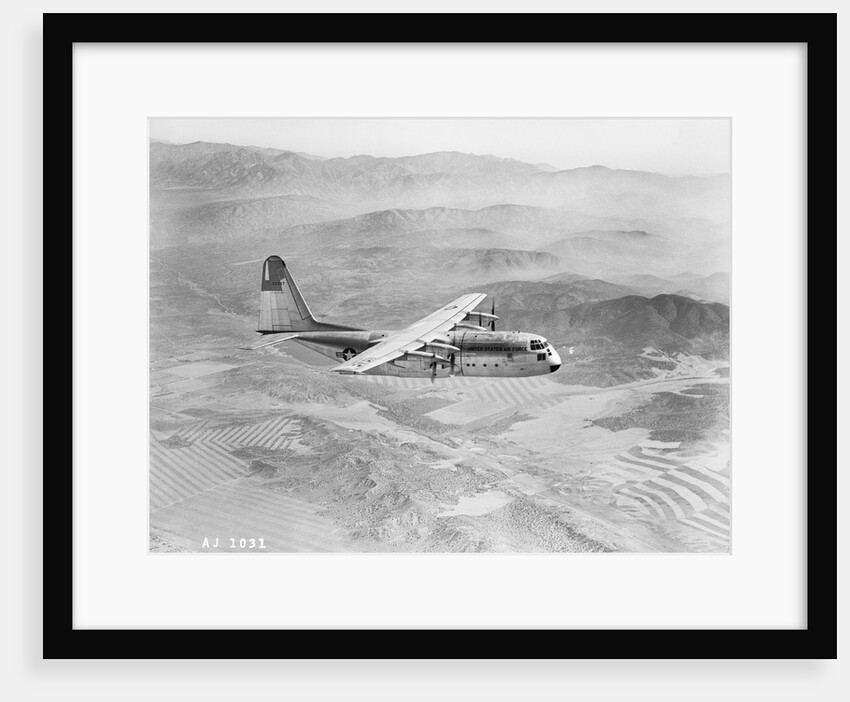 Airplane Flying Over Landscape by Anonymous