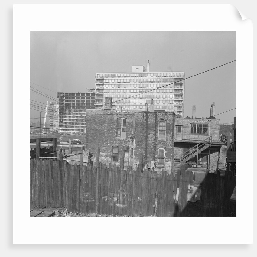Modern Apartment Building Behind Slum Tenement in Chicago by Anonymous