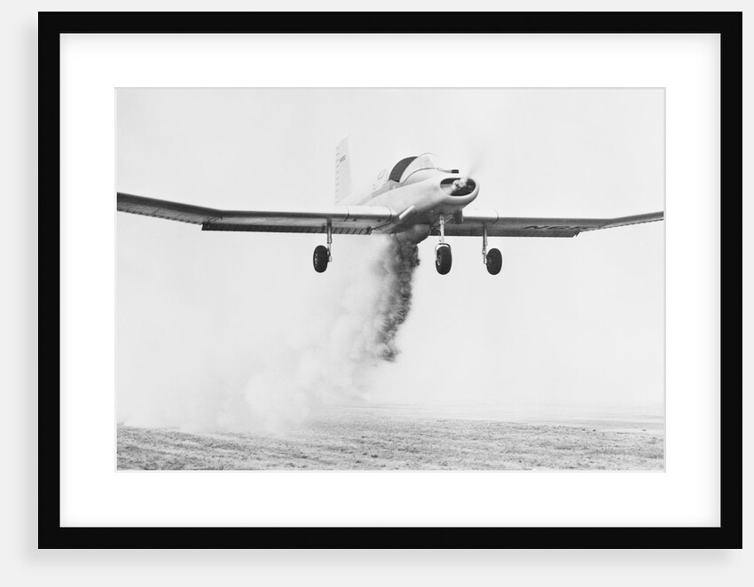 Crop Dusting Airplane in Flight by Anonymous