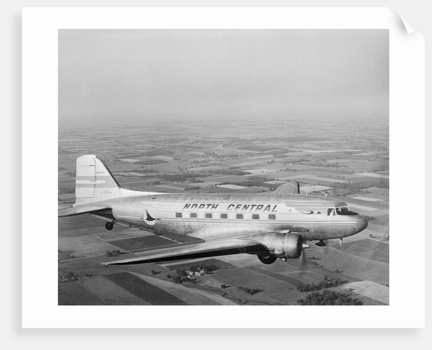Douglas DC-3 Plane in Flight by Anonymous