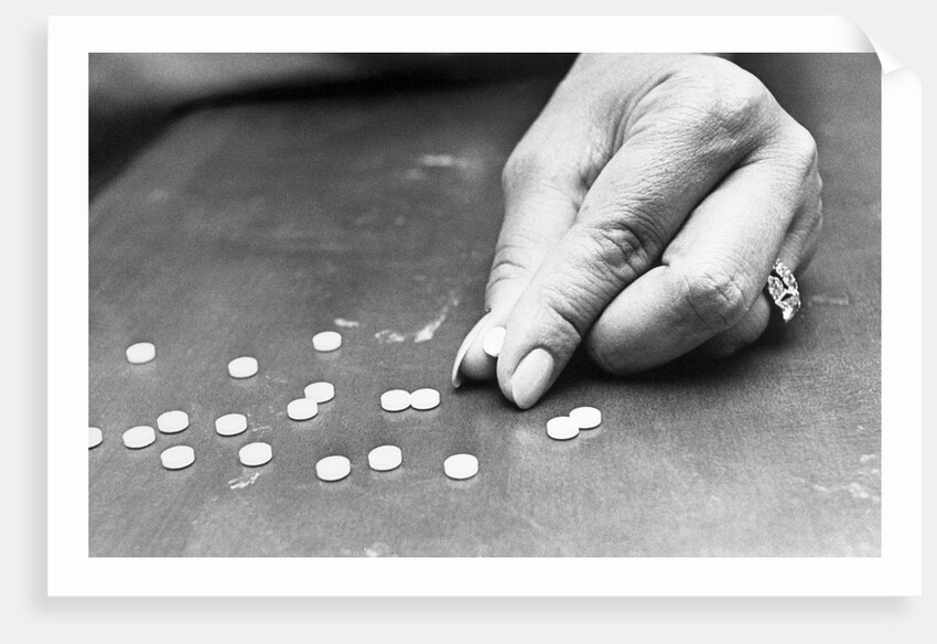 Hand Holding Pills Containing Thalidomide by Anonymous