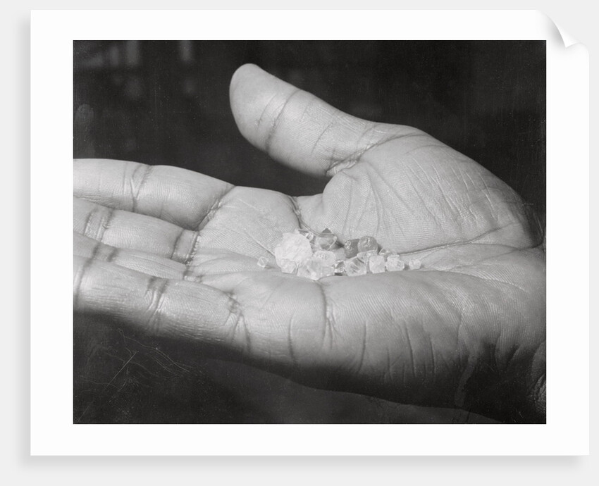 Close up of Hand Holding Diamonds by Anonymous