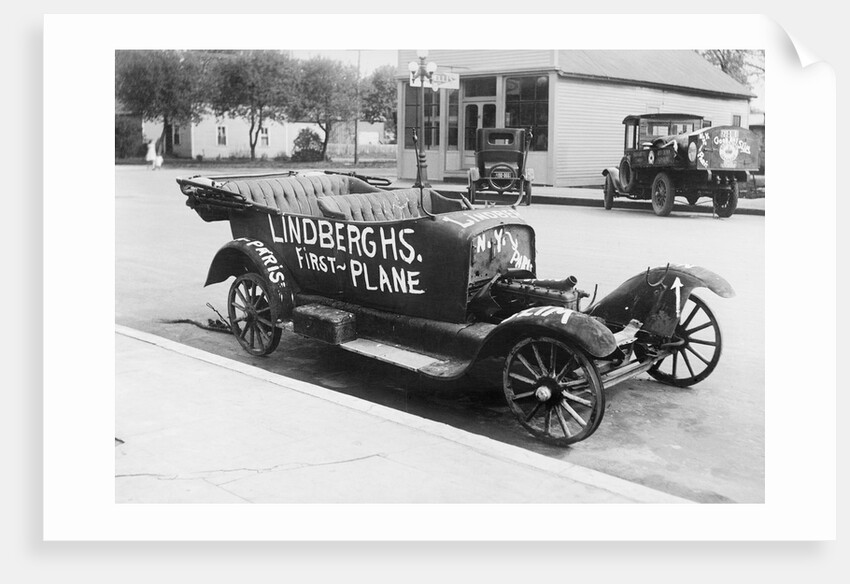 Early Model Car Parked at Station by Anonymous
