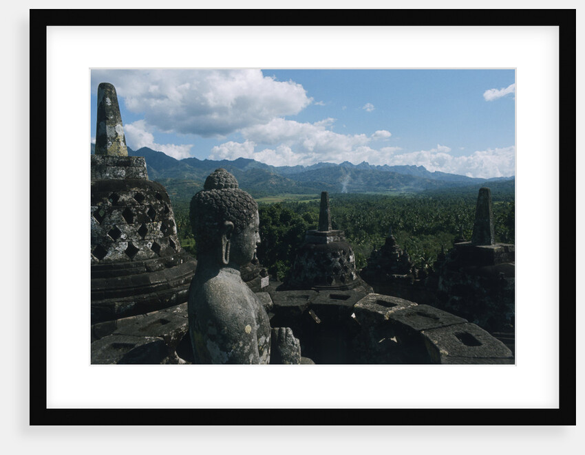 Statue of Buddha Sitting in a Stupa on Candi Borobudur by Anonymous