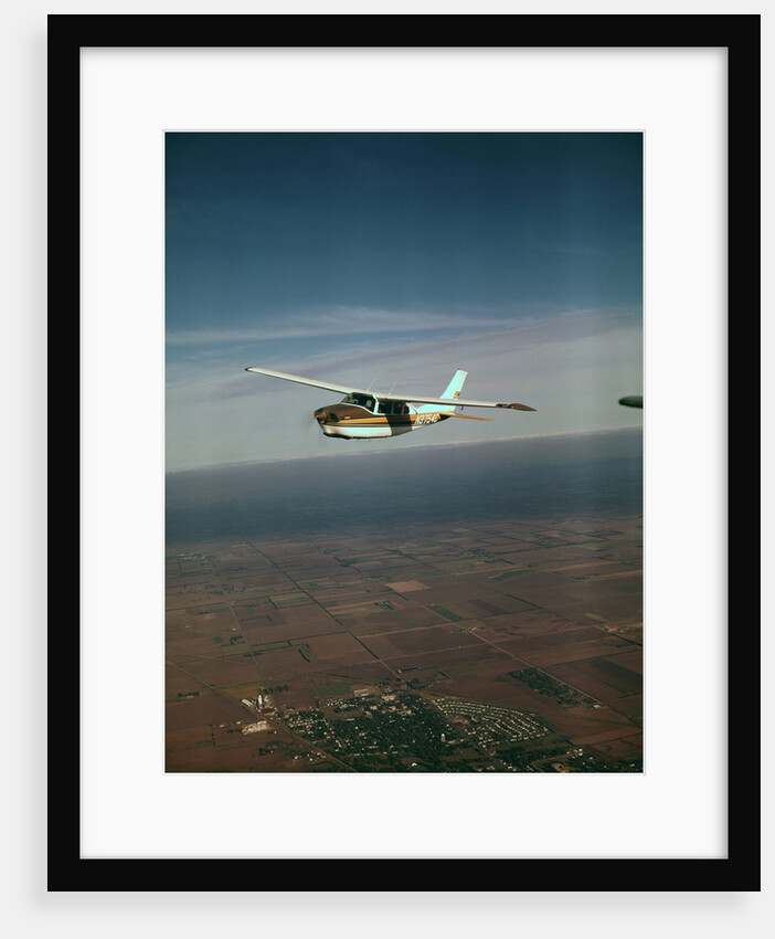 Cessna 210 Centurion Flying by Anonymous
