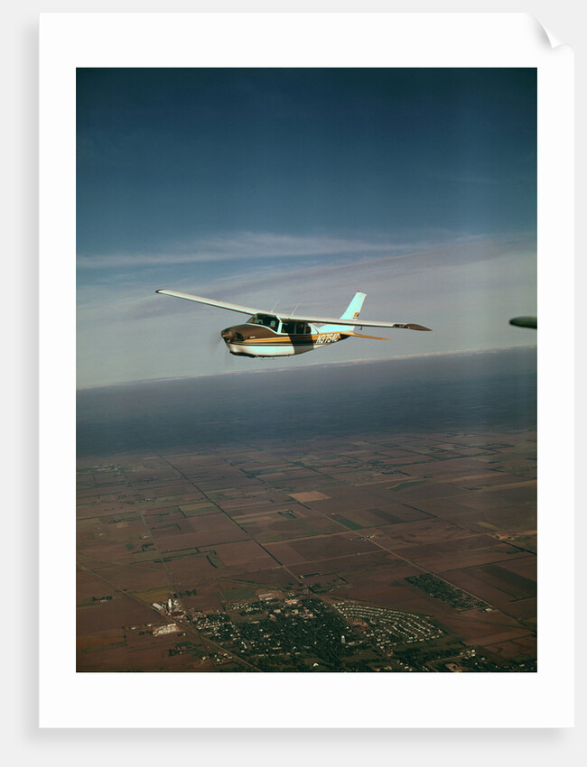Cessna 210 Centurion Flying by Anonymous