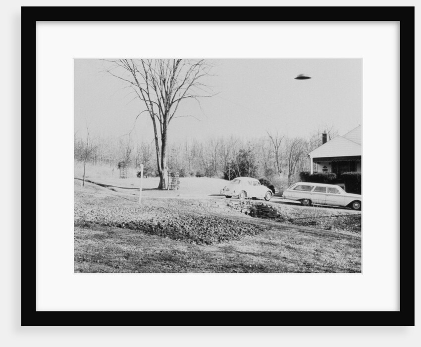 Unidentified Flying Object Flying Over House by Anonymous