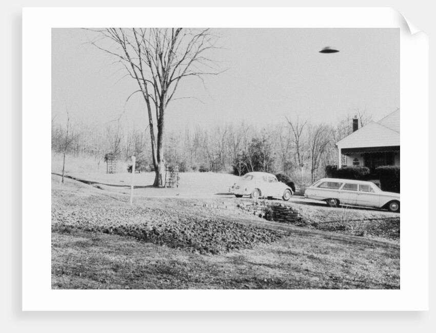 Unidentified Flying Object Flying Over House by Anonymous