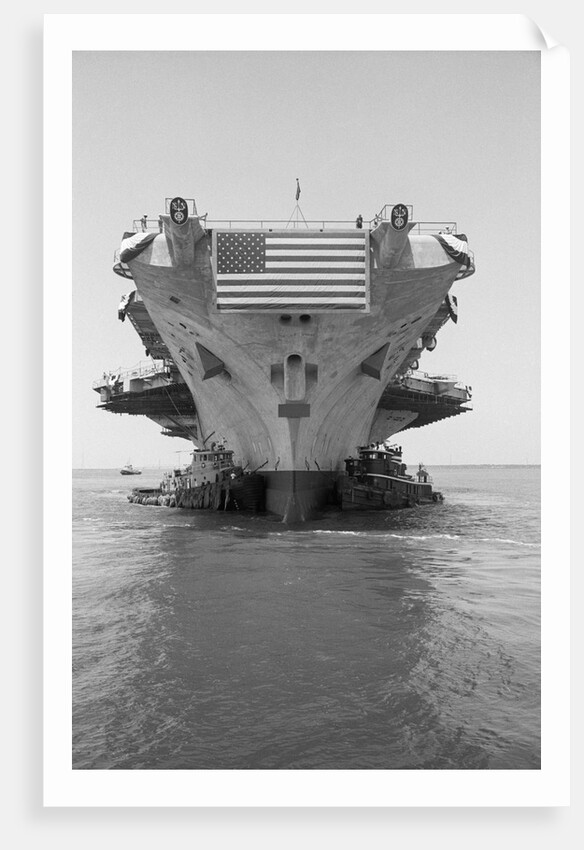 Tugboats Pushing the Aircraft Carrier John F. Kennedy by Corbis