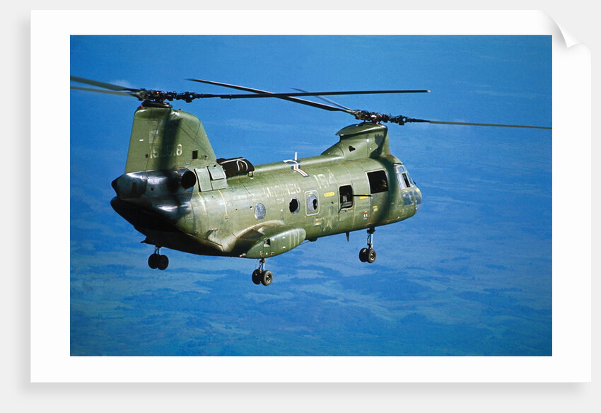 Military Helicopter Flying in Blue Skies by Anonymous