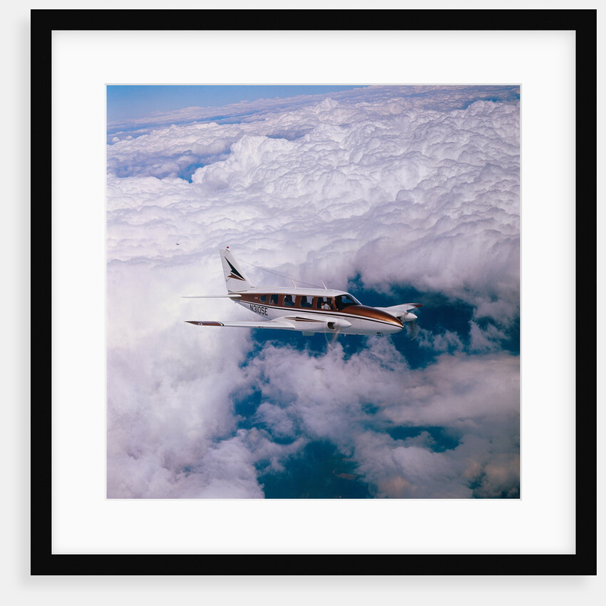 Navajo Piper Plane Flying by Anonymous