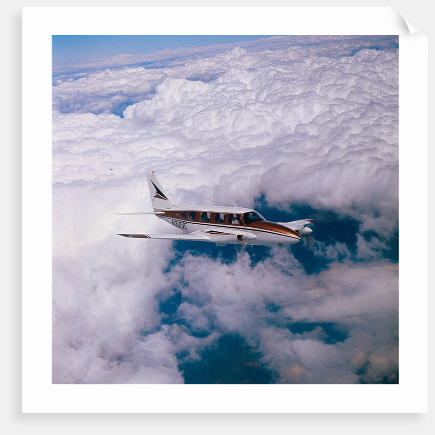 Navajo Piper Plane Flying by Anonymous