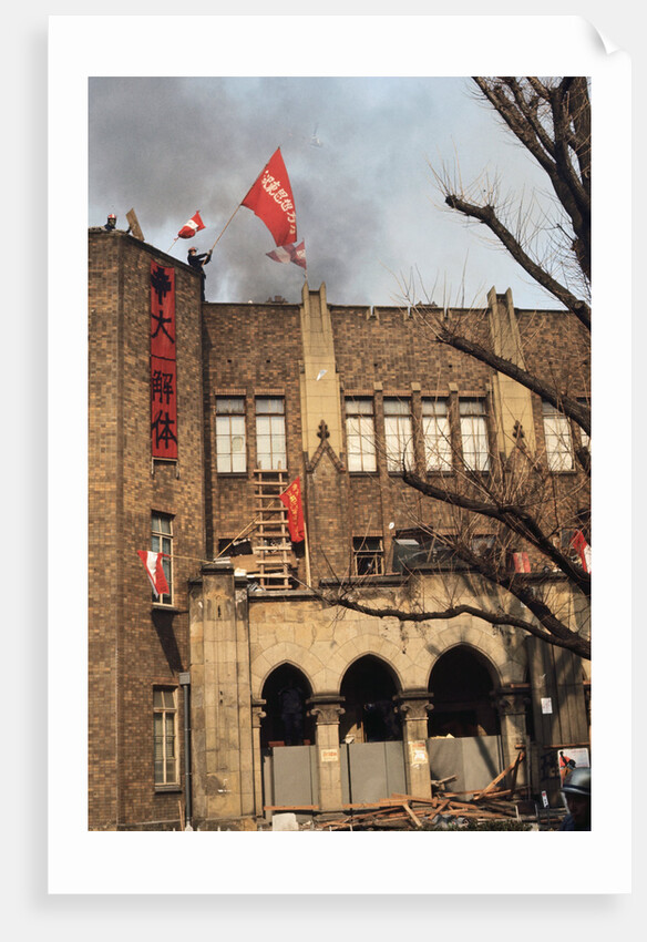 Student Waving Flag from Top of Building by Anonymous