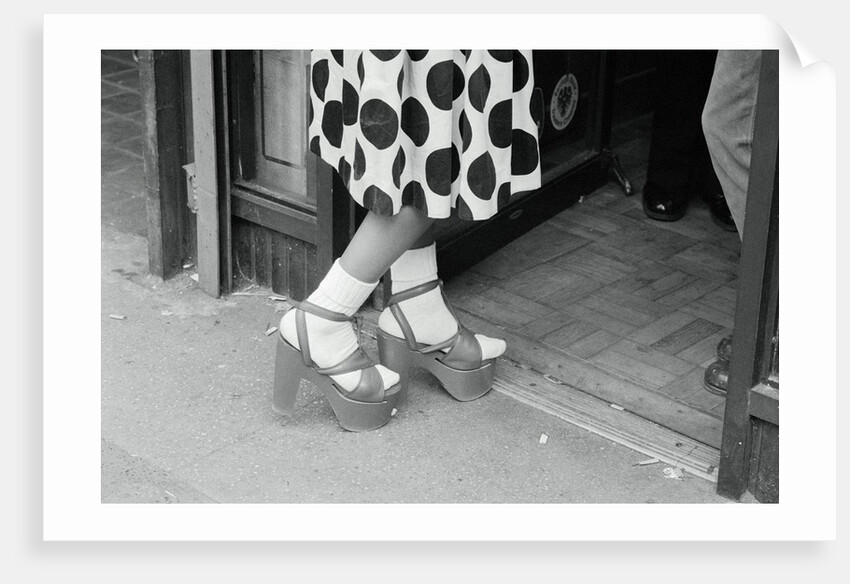 Woman Wearing High Platform Shoes by Anonymous