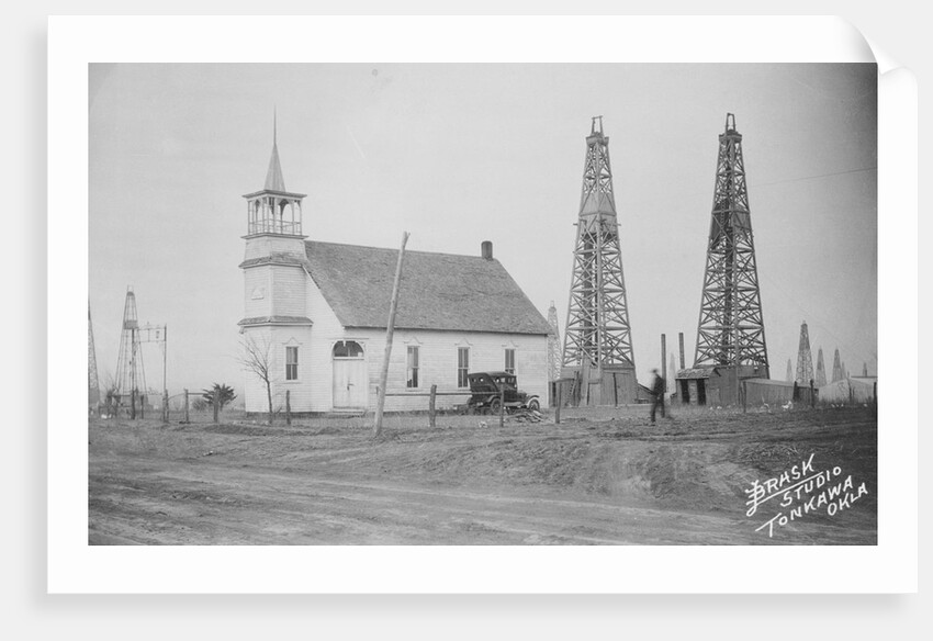 Oil Well Construction Behind Church by Anonymous